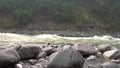 Mountain river with powerful shafts. Okinsky threshold, 5th category of complexity. Oka Sayanskaya river, Russia. Slow motion