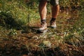 Refreshing Steps Close-Up of Man's Feet as He Explores the River on a Hiking Journey