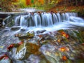 Mountain river with rapids and waterfalls at autumn time Royalty Free Stock Photo