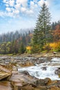 Mountain river with rapids and waterfalls at autumn time Royalty Free Stock Photo