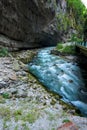Mountain river between sheer cliffs . blue clear water of the river Royalty Free Stock Photo