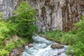 Mountain river at the sheer cliffs Royalty Free Stock Photo