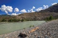 Mountain river shore stones sunny summer day Mountain Altai Katun