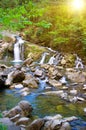 Mountain river with a small waterfall