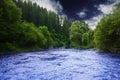 Mountain river before the storm. Dramatic scene. Beautiful nature.