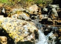 The mountain river is stream. Water runs on the rocks Royalty Free Stock Photo