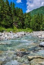 Mountain river stream water rush in rocky nature. Close up of river stream on stones. Royalty Free Stock Photo