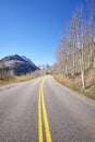 Mountain road from Aspen to Maroon Bells in autumn. Royalty Free Stock Photo