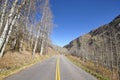 Mountain road from Aspen to Maroon Bells in autumn. Royalty Free Stock Photo