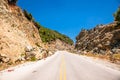 Mountain road with car and beautiful clouds in Evia, Greece