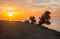 A mountain road, at the end of which is sunset and sea, sky and clouds and way, Beautiful view of a road leading to sunset with sm Royalty Free Stock Photo