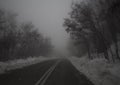 Mountain road, fog, clouds and snow in the forest in the mountains Dirfis on the island of Evia, Greece Royalty Free Stock Photo