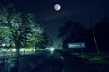 Mountain Road through the forest on a full moon night. Scenic night landscape of dark blue sky with moon. Azerbaijan. Long shutter Royalty Free Stock Photo