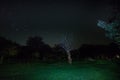 Mountain Road through the forest on a full moon night. Scenic night landscape of dark blue sky with moon. Azerbaijan. Long shutter Royalty Free Stock Photo