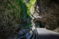 Mountain road in the gorge of the mountains near the city in Italy San Pelegrino