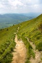 Mountain road landscape, blue sky and white clouds, Poland