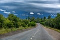 Mountain road. Landscape with rocks, sunny sky with clouds and beautiful asphalt road in the evening in summer. Vintage toning. Tr Royalty Free Stock Photo