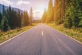 Mountain road. Landscape with rocks, sunny sky with clouds and beautiful asphalt road in the evening in summer. Vintage toning. Royalty Free Stock Photo