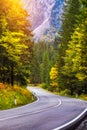 Mountain road. Landscape with rocks, sunny sky with clouds and beautiful asphalt road in the evening in summer. Vintage toning. Royalty Free Stock Photo