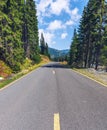 Mountain road. Landscape with rocks, sunny sky with clouds and beautiful asphalt road in the evening in summer. Vintage toning. Royalty Free Stock Photo