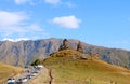 Mountain Road Leading to the Iconic Gergeti Trinity Church in the Town of Stepantsminda, Kazbegi, Georgia Royalty Free Stock Photo