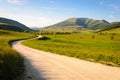 A mountain road with the Mount Pennino in the background