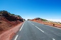 Mountain road over the clouds. Traffic signs `risk of snow` on roadsides. Teide National Park, Tenerife, Canary Islands, Spain Royalty Free Stock Photo