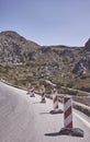 Mountain road with portable warning traffic signs Royalty Free Stock Photo