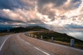 Mountain road at sunset. Empty asphalt road through the mountains of Serra Da Estrela natural park, Northern Portugal Royalty Free Stock Photo