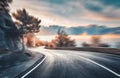 Mountain road at sunset with motion blur effect. Asphalt road Royalty Free Stock Photo