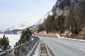 Mountain road in Swiss alps at an overcast winter day. Val Bregaglia, canton Graubunden, Switzerland Royalty Free Stock Photo
