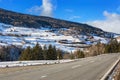 Mountain road in Swiss alps at sunny winter day . Engadine valley , Graubunden; Switzerland