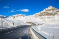 Mountain road in Swiss alps at sunny winter day, Julier Pass, Graubunden, Switzerland. Julier Pass - mountain pass in Switzerla