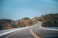 Mountain road in Thailand. sunny sky with clouds and beautiful asphalt road in summer. Royalty Free Stock Photo