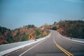 Mountain road in Thailand. sunny sky with clouds and beautiful asphalt road in summer. Royalty Free Stock Photo