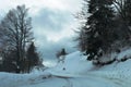 Mountain road and traffic signs in the snow Royalty Free Stock Photo