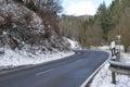 mountain road in a valley with late snow Royalty Free Stock Photo