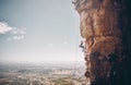 Mountain, rock climbing and sport with a sports woman and climber abseiling on a mountainside outdoor in nature. Fitness Royalty Free Stock Photo