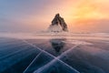 Mountain rock on frozen water lake with sunset tone Royalty Free Stock Photo