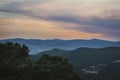 Mountain scenery. Beautiful sunset above the tops of the mountains. Sunset in the sky and mountains in the mist. Royalty Free Stock Photo