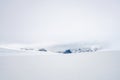 Mountain scenery far away in snow covered landscape during winter time. Royalty Free Stock Photo