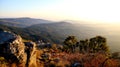 Mountain scenic nature scene with green trees and sunrise in the background Royalty Free Stock Photo