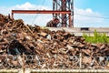 A mountain of scrap metal - mainly ferrous metals on the territory of a metallurgical plant