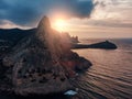 Mountain in sea, large rock at beautiful sunset and seascape nature landscape, aerial panoramic view Royalty Free Stock Photo