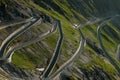 Mountain serpentine in the alps. view of the free road in the forest among the rocks Royalty Free Stock Photo