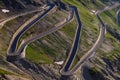 Mountain serpentine in the alps. view of the free road in the forest among the rocks Royalty Free Stock Photo