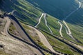 Mountain serpentine in the alps. view of the free road in the forest among the rocks Royalty Free Stock Photo