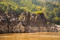 The Mekong river in Laos. River shore and tropical jungle.