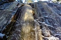 mountain side covered in ice in forest Narke Sweden Royalty Free Stock Photo