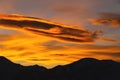 mountain silhouette of austrian alps at sunrise or sunset of glowing sky. scenic view in the mountains Royalty Free Stock Photo